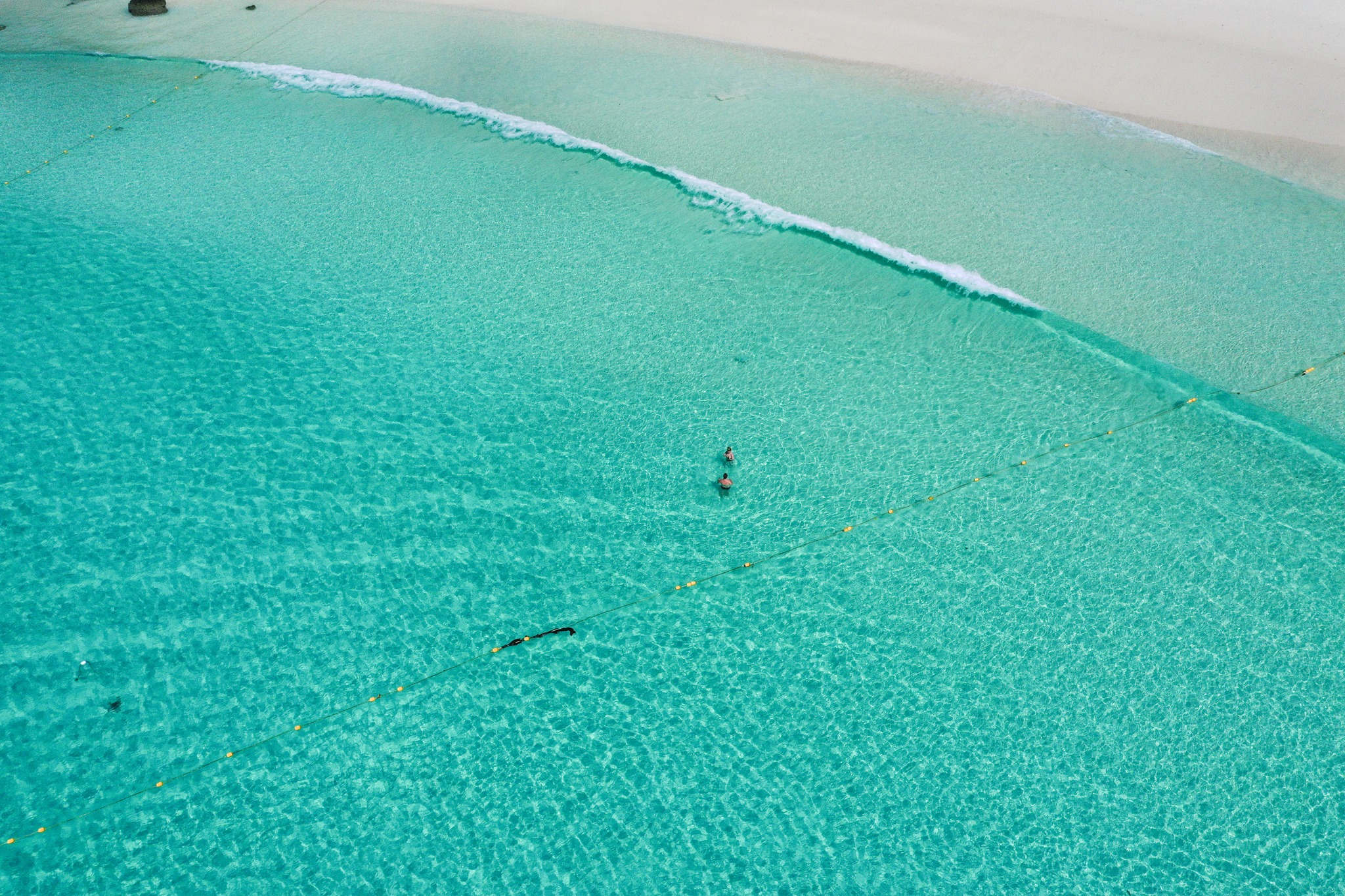 Clear water along Patok Beach on Racha Island