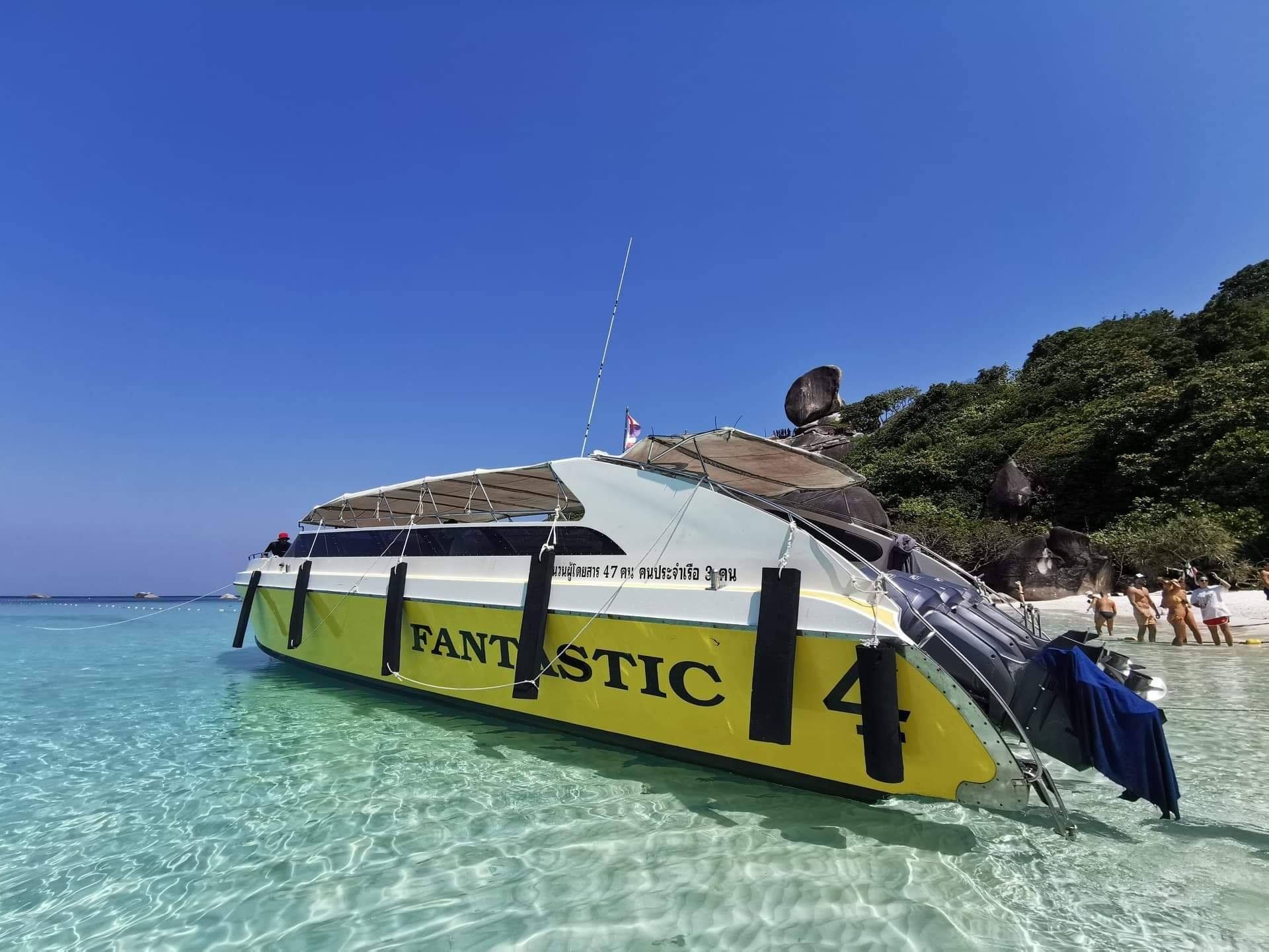 Fantastic yellow speedboat beside a Similan Island beach