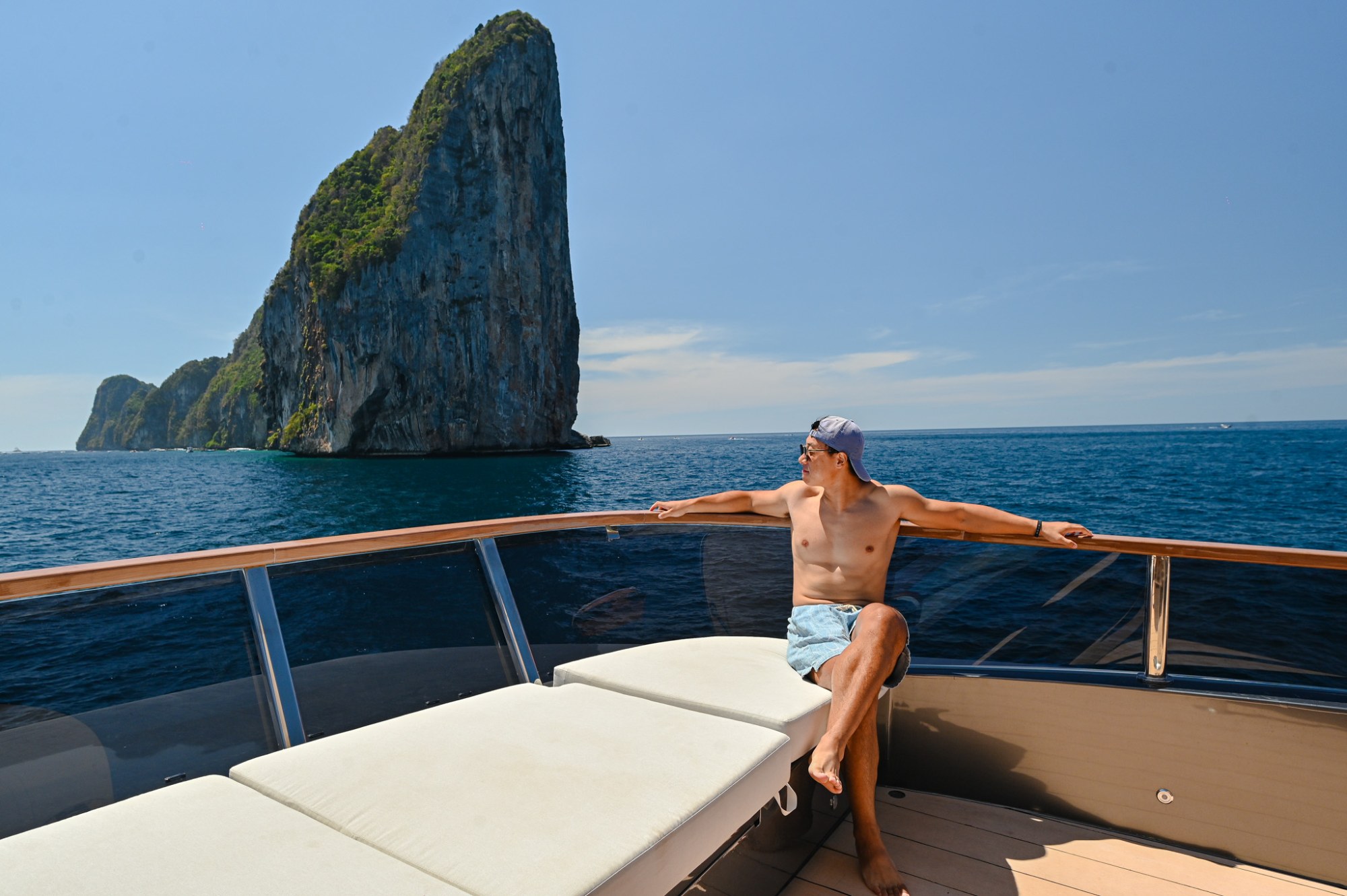 Guest enjoying panoramic Phi Phi Island views from Noah Yacht