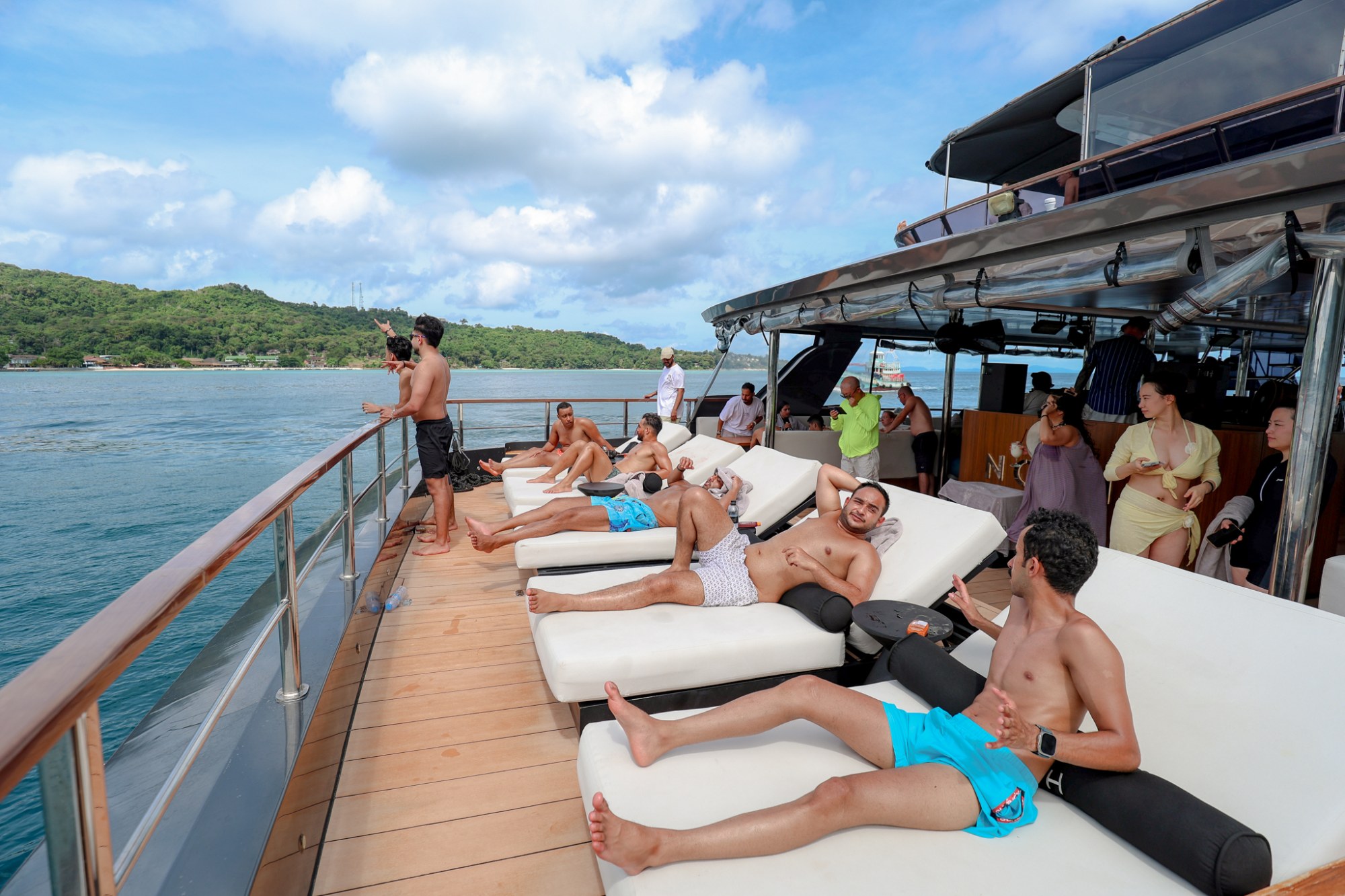 Guest relaxing on the spacious bow sunbed aboard Noah Yacht