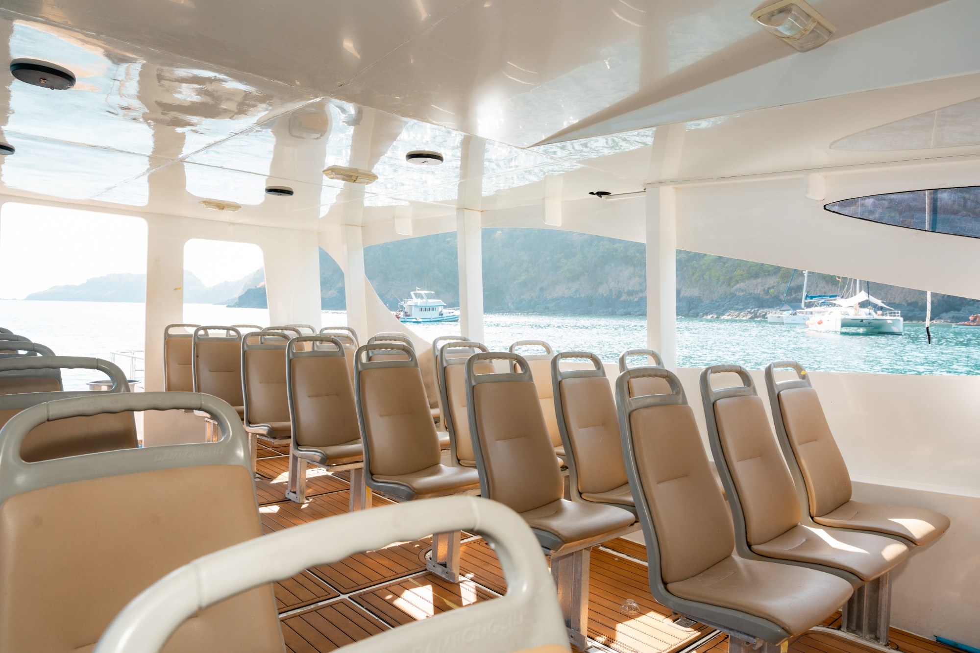 Individual cabin seats and wooden floor aboard Taurus