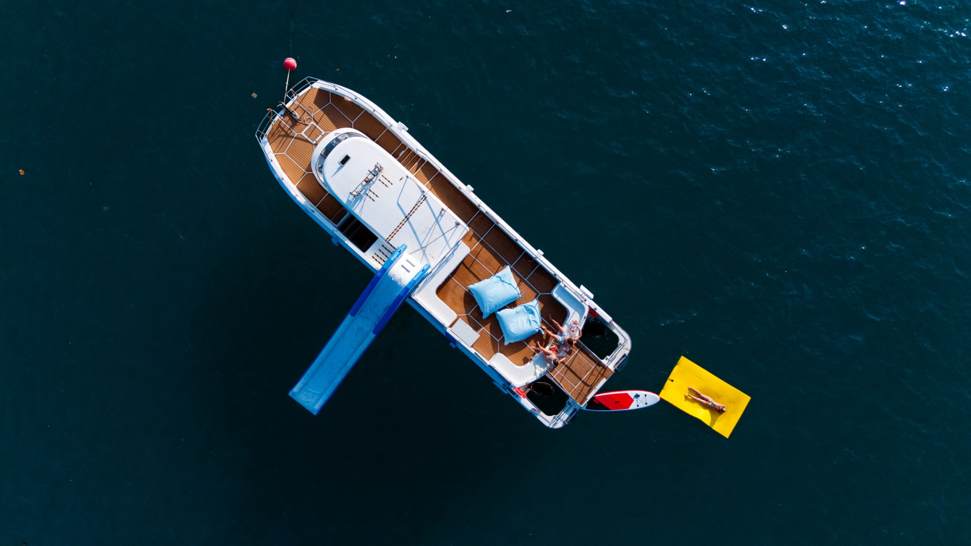 Aerial view of Taurus with its waterslide, floating mat and paddleboard