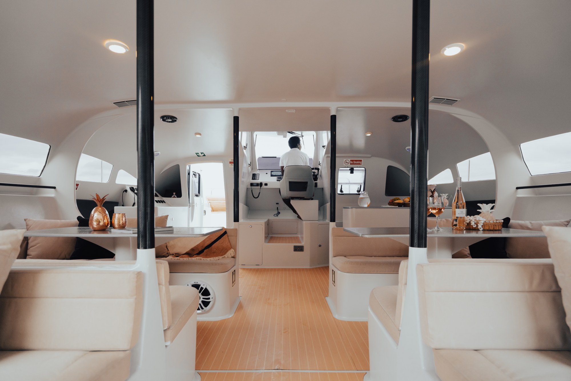 Comfortable minimalist seating inside Vibes Catamaran Yacht