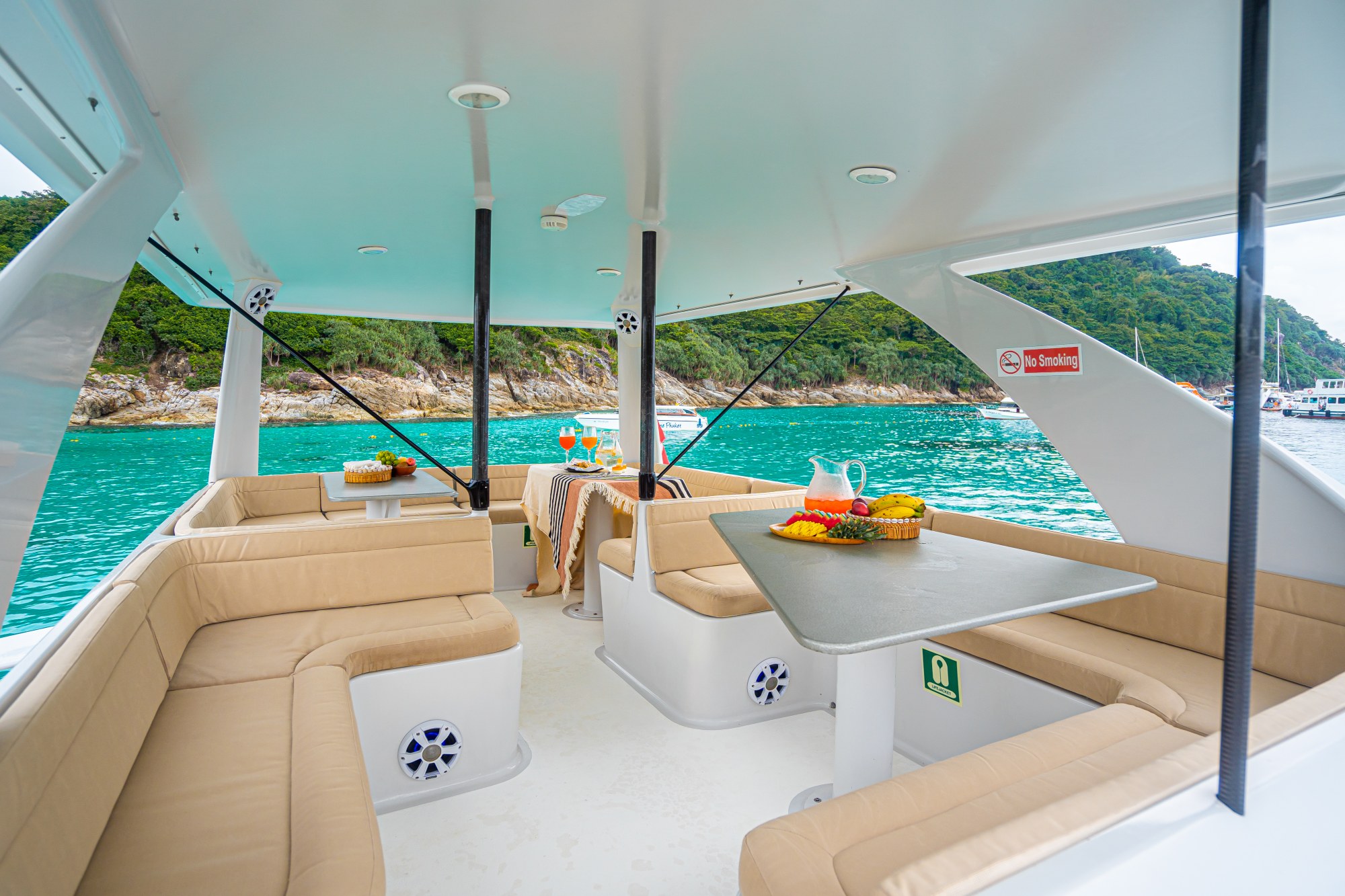 L-shaped sofa and table inside Vibes Catamaran Yacht